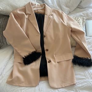 Matching blazer and pant set. Feather trims.